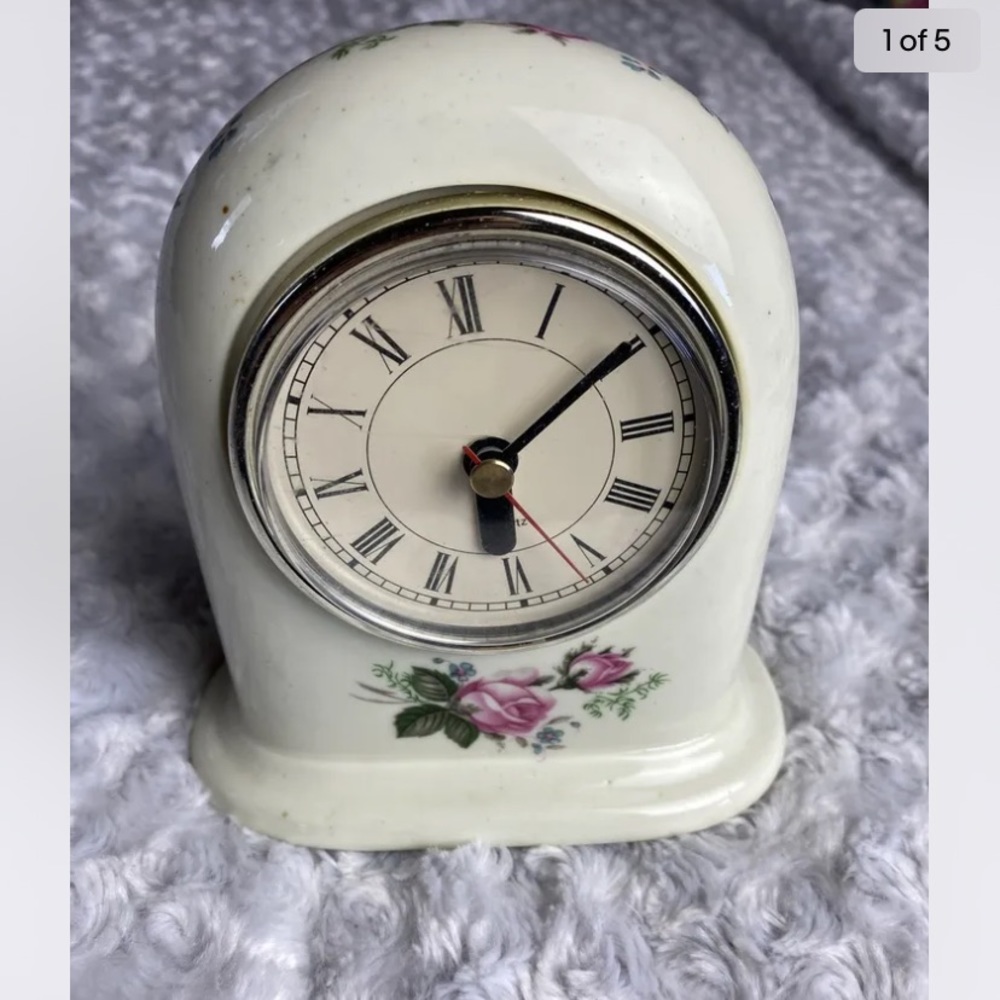 Vintage Porcelain Floral Painted Clock. Movement made by Ingraham